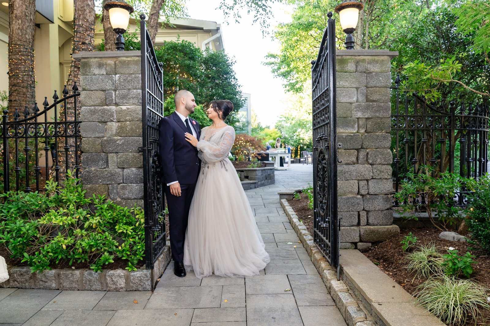 Couple photographed at the garden gate