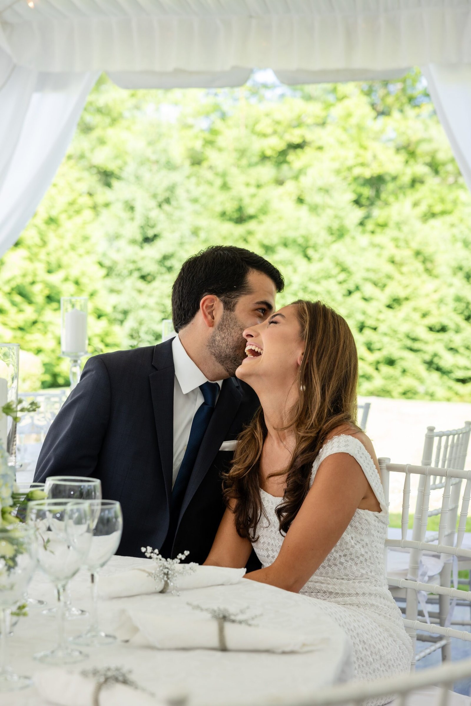 Couple laughing together at their table
