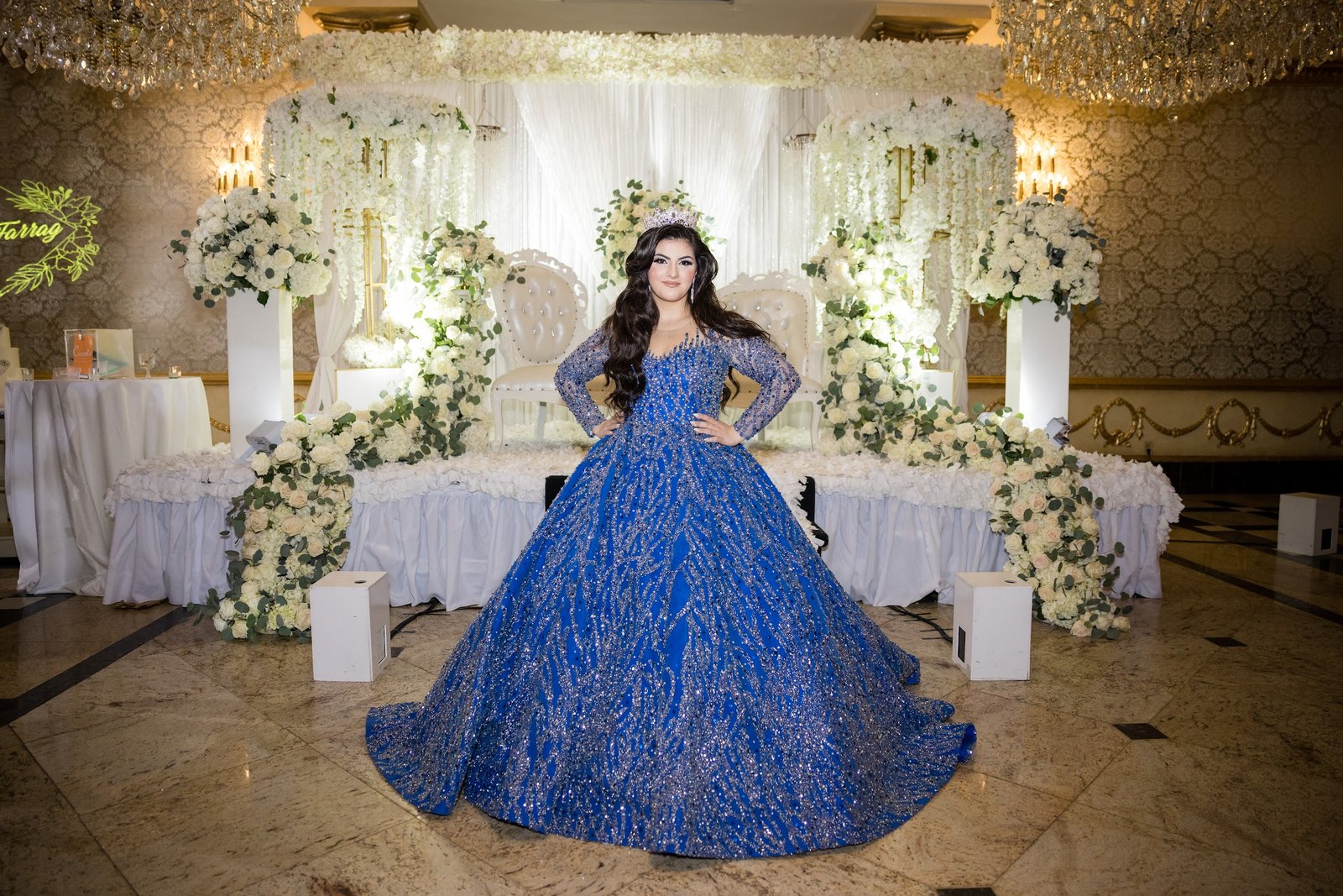 Sweet 16 celebrant in a blue ballgown at her party
